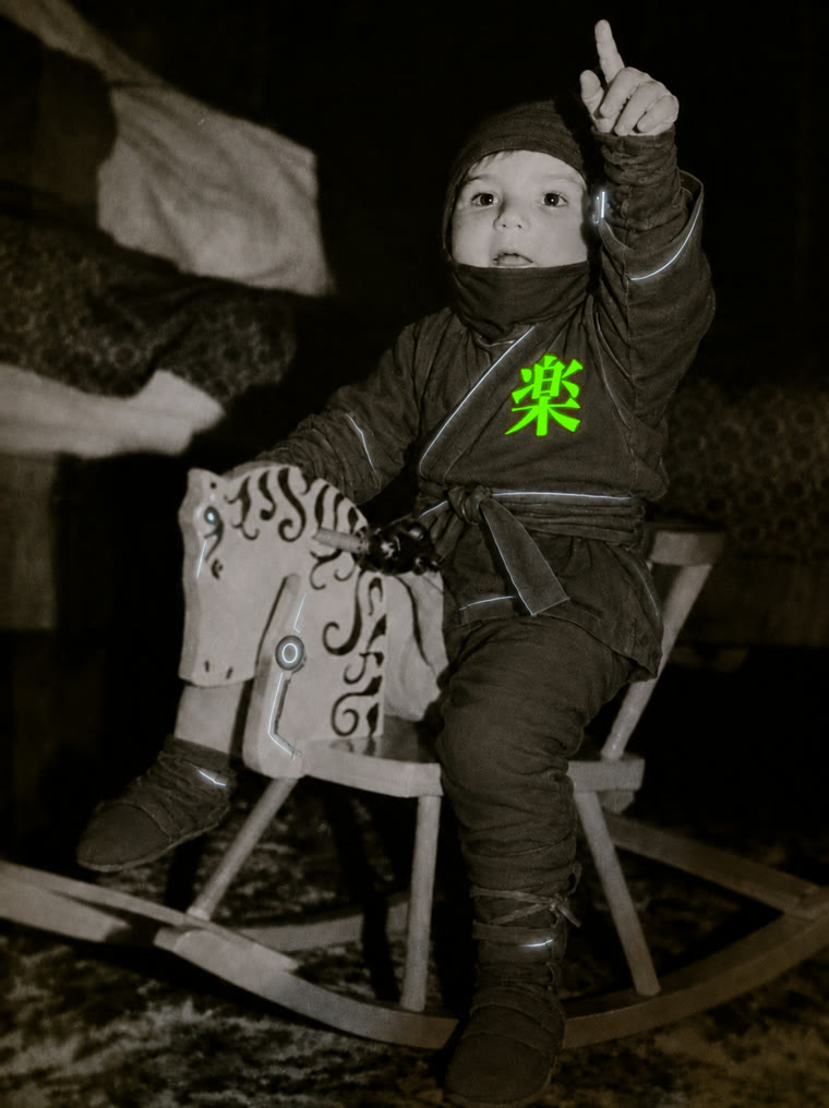 Ninja as a child in a ninja outfit, the kanji raku glowing on the kimono